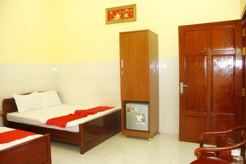 a small room with a bed and a cabinet at Tan My Thien Hotel in Tây Ninh