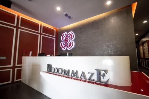 a sign for a mongolia company on a wall at Bloommaze Boutique Hotel Puchong in Puchong