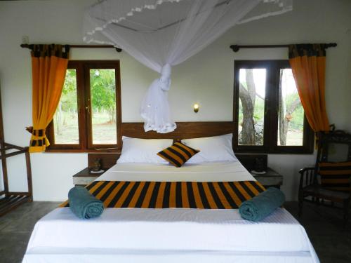 Tempat tidur dalam kamar di The Ibis - Wilpattu