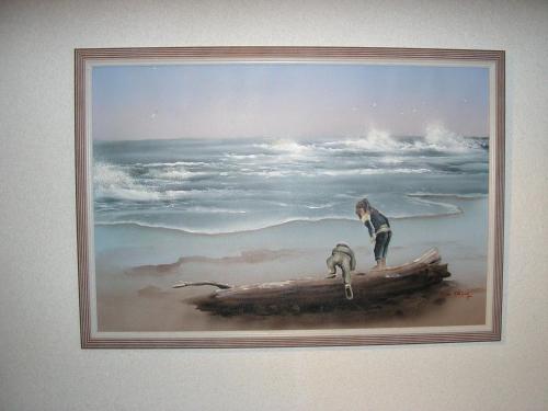 a painting of a woman and two birds on a log at Pension Villa Beer in Stralsund