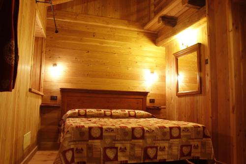 Ένα ή περισσότερα κρεβάτια σε δωμάτιο στο Affittacamere Grand Saint Bernard