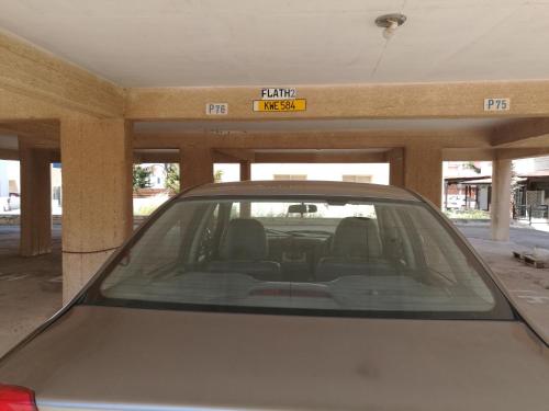 a car parked in front of a garage at Siamese Villa in Paralimni