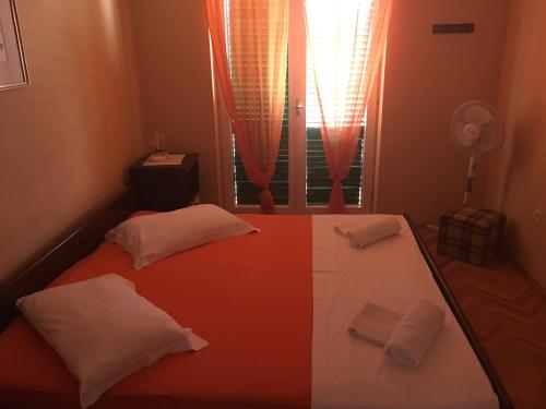 Postel nebo postele na pokoji v ubytování Apartments Ankica