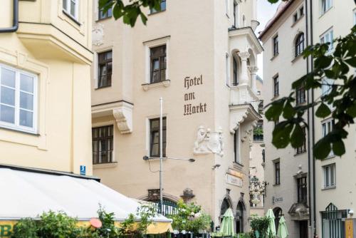 a building with a sign on the side of it at Hotel Am Markt in Munich