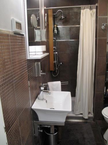 a bathroom with a sink and a shower and a toilet at Studio Apartment Sofia - Poreč Old Town Quiet Oasis with FREE parking in Poreč