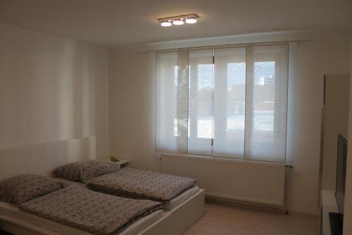 Кровать или кровати в номере Murtal Apartments