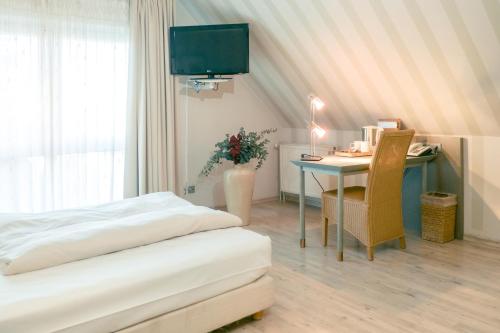 Una cama o camas en una habitación de Ambiente Langenhagen Hannover by Tulip Inn