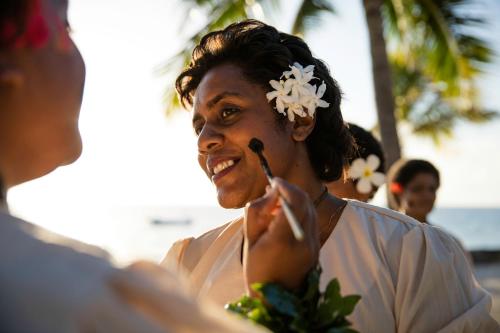 a woman with a flower on her face at Castaway Island, Fiji in Castaway Island