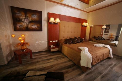 Ένα ή περισσότερα κρεβάτια σε δωμάτιο στο Princessa Hotel