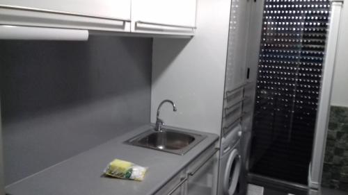 Apartamentos Turísticos Los Ángeles tesisinde mutfak veya mini mutfak