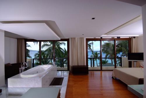 Postel nebo postele na pokoji v ubytování Boracay Beach Houses