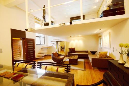 a large living room with a loft at Boracay Beach Houses in Boracay