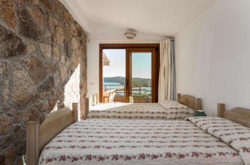 Ένα ή περισσότερα κρεβάτια σε δωμάτιο στο Molarotto