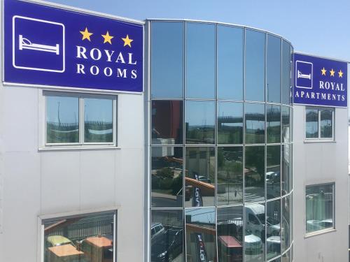 a building with a sign that reads royal rooms at Royal Apartments & Rooms in Zagreb