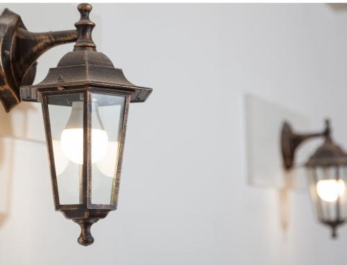 a couple of lights hanging on a wall at Resort Big House Plitvička jezera in Ličko Petrovo Selo