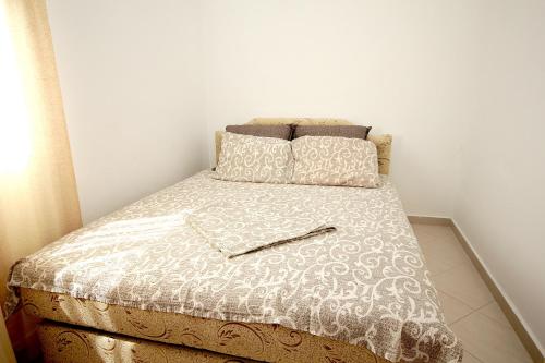 Apartments Sošić tesisinde bir odada yatak veya yataklar
