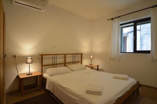 Posteľ alebo postele v izbe v ubytovaní Apartment Il Cortile with garden and parking