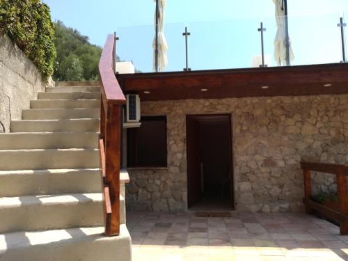 a set of stairs leading to a building with a door at Villa Greco in Rossano