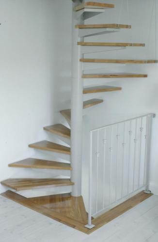 a wooden staircase in a room with white walls at Clos Mirabel Manor - Holiday rental in Jurançon