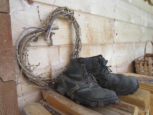 a pair of black boots hanging on a wall at Ferienhaus Mandlhof in Weer