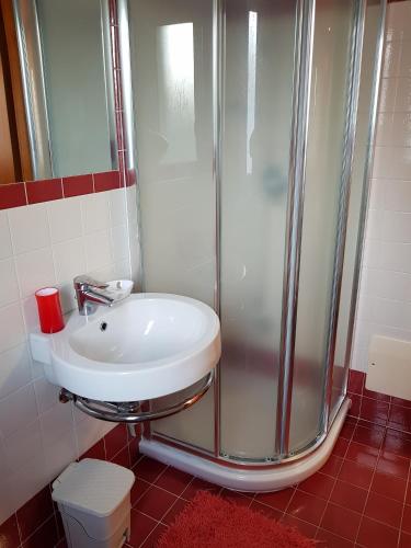 a bathroom with a sink and a shower at Casa Del Sole in Soverato Marina
