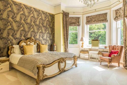 a bedroom with a large bed and a window at Derby Manor in Bournemouth