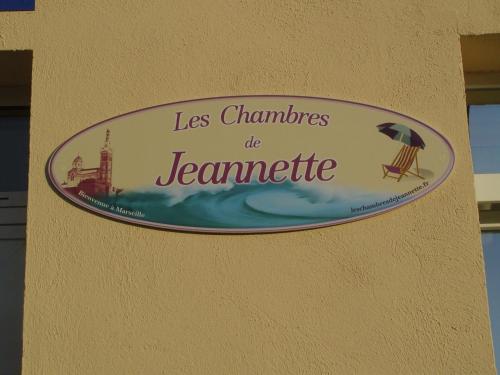 a sign on a building that reads les champs de journerate at Les Chambres de Jeannette in Marseille