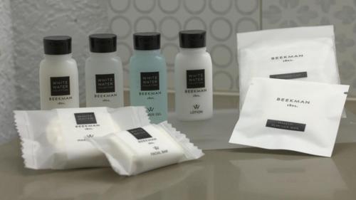 a group of three bottles of moisturizers on a table at Country Inn & Suites by Radisson, Griffin, GA in Griffin