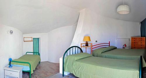 Ein Bett oder Betten in einem Zimmer der Unterkunft B&B Al Cavalluccio Marino