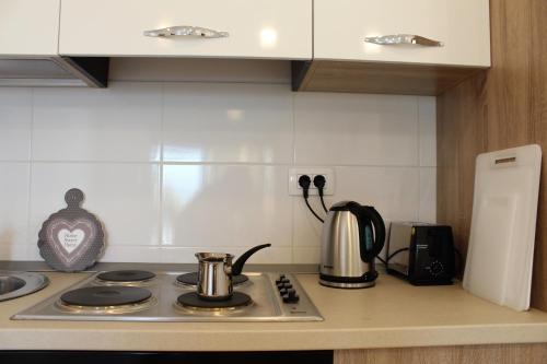 a kitchen counter top with a stove top oven at Villa Eva in Radanovići