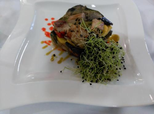 a white plate with a piece of food on it at Hotel La Palma de Llanes in Llanes