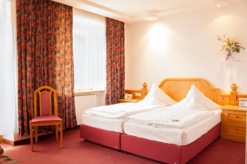 Ένα ή περισσότερα κρεβάτια σε δωμάτιο στο Elbhotel Bad Schandau