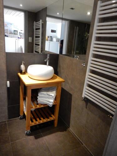 a bathroom with a sink and a shower at Holiday Home SLAVIA NEW 012 in Międzyzdroje