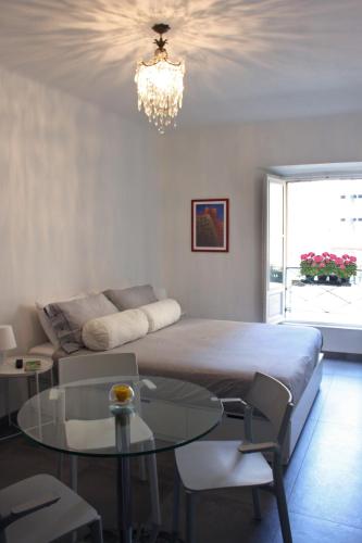 a bedroom with a bed and a glass table at La Marina di Milano in Milan