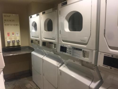 a row of white washers and dryers in a kitchen at Sunstone Lodge by 101 Great Escapes in Mammoth Lakes