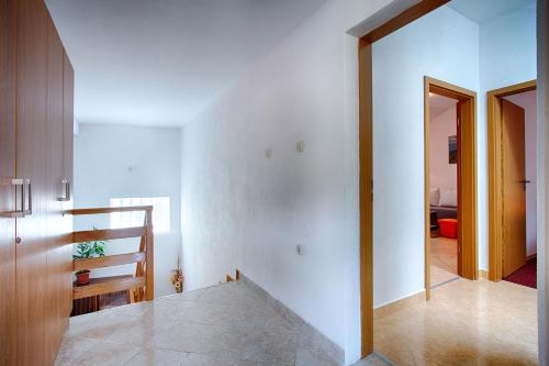 En eller flere senge i et værelse på Apartman Babić