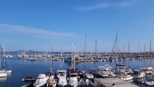a bunch of boats docked in a harbor at Alghero Vacanze Hotel in Alghero