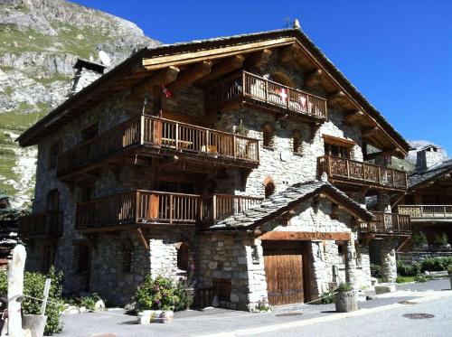 a building with balconies on the side of it at Chalet l'Avalin in Val dʼIsère