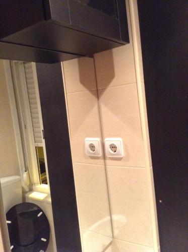 a bathroom with a sink and a toilet in a room at Apartment Lissabon Estrela in Lisbon