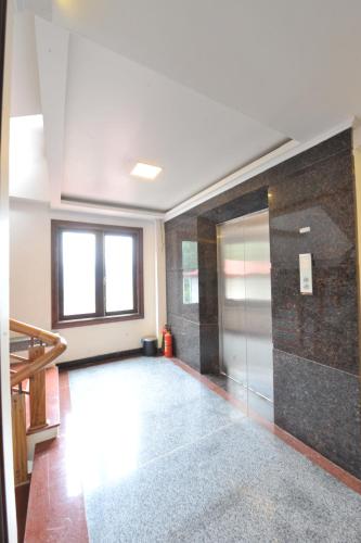 a large room with a glass door in a building at Delta Sapa Hotel - Old Quarter Center in Sa Pa