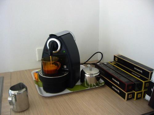 a blender sitting on a table with books at Architectural City Loft in Sofia