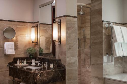 a bathroom with a sink and a shower at Four Seasons Hotel The Westcliff in Johannesburg