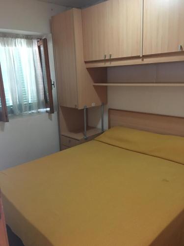 Ένα ή περισσότερα κρεβάτια σε δωμάτιο στο Residence Dolce Far Niente