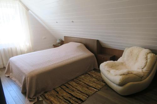Postel nebo postele na pokoji v ubytování Apartmenti Zvejniekciema