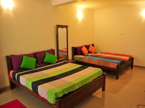 En eller flere senger på et rom på Resort Beam