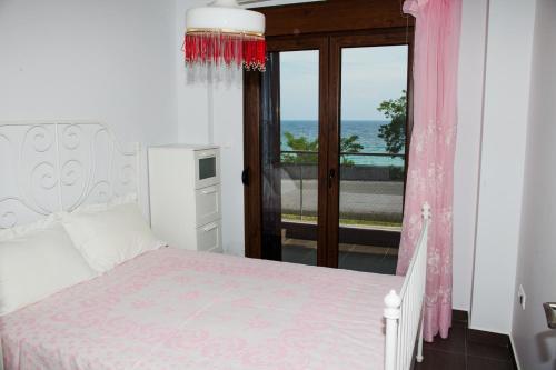 Postel nebo postele na pokoji v ubytování Sea view appartment in Geoponika