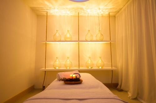 a room with a bunch of vases on shelves at Aelia Wellness Retreat in Nicosia