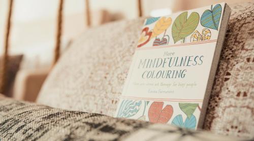 a book sitting on top of a couch at Aelia Wellness Retreat in Nicosia