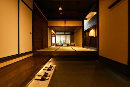 a japanese room with at Kuraya Senbonsanjo in Kyoto
