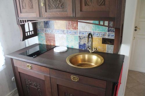 a bathroom with a sink and a counter top at The Guest Apartment in Viljandi